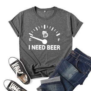 Close-up of gray cotton t-shirt with I Need Beer print styled with denim and sneakers
