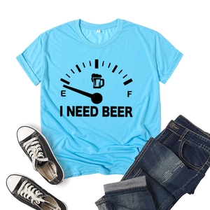 Detailed flat lay of light blue T-shirt featuring 'I NEED BEER' graphic print