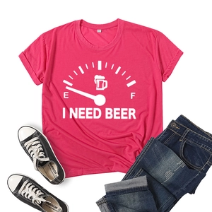 Flat lay of pink cotton T-shirt featuring I Need Beer print with casual denim and sneakers
