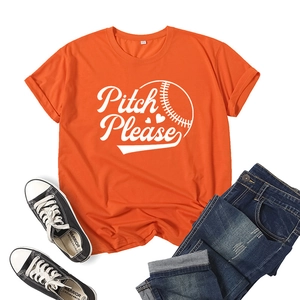 Detail view of orange T-shirt with Pitch Please print styled with denim shorts