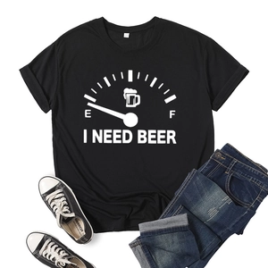 Women's black cotton t-shirt with 'I Need Beer' graphic print, laid flat with jeans