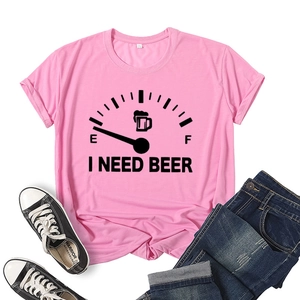 Pink cotton T-shirt with I Need Beer fuel gauge print, paired with jeans and shoes