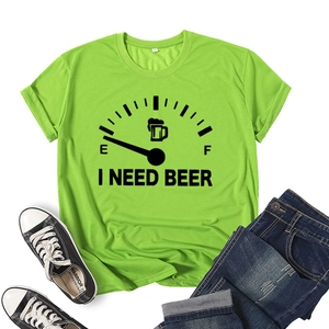 Flat lay of lime green I Need Beer t-shirt styled with jeans and canvas sneakers