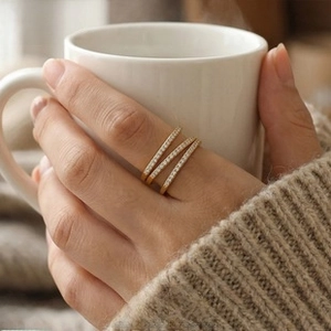 Close-up of triple-layered gold-plated ring with micro-pave white zircon stones