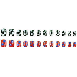 Detail of short square press-on nails with floral rhinestone accents in green and orange