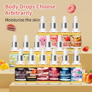 Macro display of assorted Body Drops scents in glass dropper bottles on yellow background
