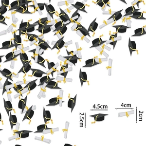 Graduation party confetti with mini black mortarboards and white scrolls decorations