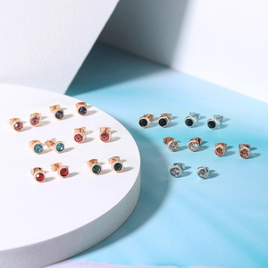 Detailed arrangement of 4mm round zircon studs in various colors with metallic backings