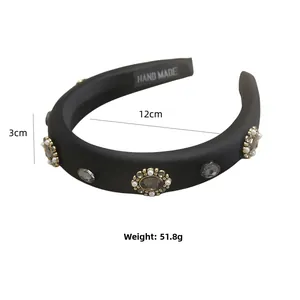 Detail of 3cm wide black headband with grey rhinestones and white pearls and gold base