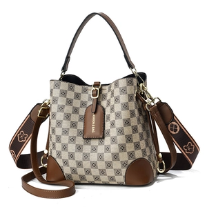 Vintage checkered bucket bag with leather handles and patterned wide shoulder straps
