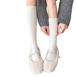 White wool knit knee-high socks with textured stripes and warm fleece material