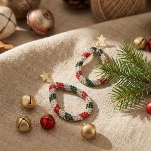 Christmas rhinestone water drop earrings with golden star stud on beige linen background