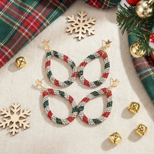 Christmas colorful rhinestone teardrop earrings with golden star stud in festive setting