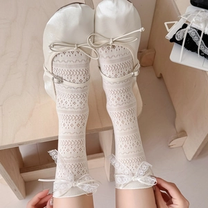 Ballet style white lace mesh knee high socks with satin bow and rhinestone details