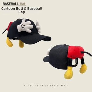 Detail of creative black knit hat featuring 3D cartoon plush hand and leg decorations
