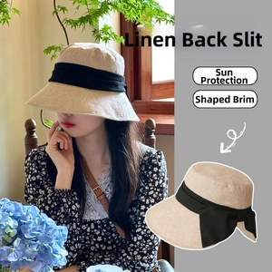 Detail of linen sun hat with back split for ponytails and black ribbon bow accent