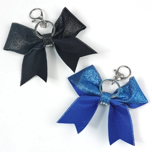 Glitter leather bow keychains in blue and black with rhinestones and silver metal clips