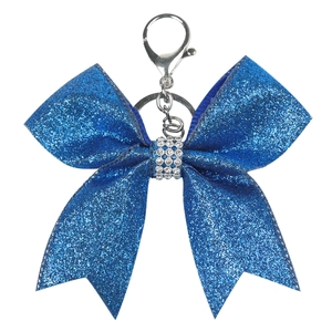 Close-up of royal blue glitter bow keychain with rhinestones and silver clasp