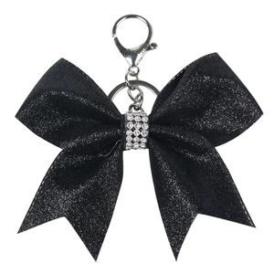 Sparkling black glitter bow keychain with rhinestone center and silver metal clasp