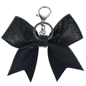 Sparkling black glitter bow keychain accessory with silver metal ring and lobster clasp