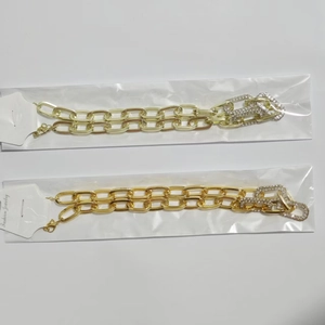 Detail of chunky chain necklace with crystal rhinestone pavé and lobster clasp