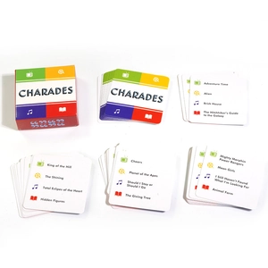 Detailed top view of Charades board game cards featuring movie and music categories