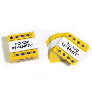 Detailed view of 'Do You Remember?' card game with yellow storage box and card deck