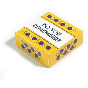 Detail of yellow Do You Remember? card game box with blue typography and clock icons