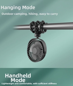 Close-up of flexible black octopus tripod for portable fan hanging on a metal bar