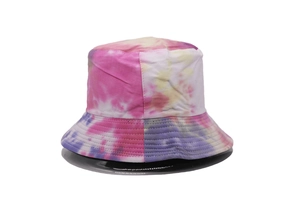 Close-up of a tie-dye bucket hat with colorful pink and yellow patterns on white fabric