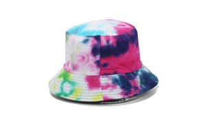 Close-up of vibrant tie-dye pattern and soft cotton fabric on reversible bucket hat