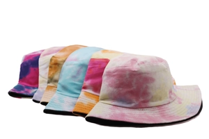Detailed arrangement of five colorful tie-dye bucket hats with vibrant patterns and wide brims
