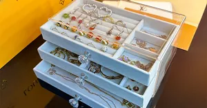 Three-layer acrylic jewelry box with velvet lining and elegant crystal handles