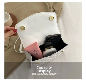 Interior view showing the large capacity of the white quilted crossbody bag with daily items