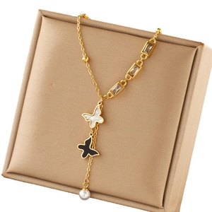 Gold layered butterfly necklace with pearls and black enamel pendant for women