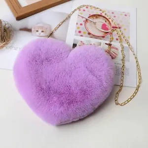Purple faux rabbit fur heart-shaped crossbody bag with a gold metal chain strap