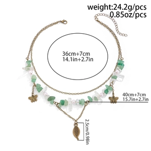 Detailed view of layered bohemian leaf necklace with size dimensions in centimeters