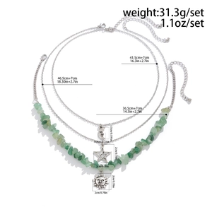 Three-layer layered necklace showing lengths and weights with moon and star pendants