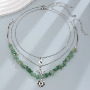 Three-layer vintage celestial necklace with moon, star, and green stone sun pendants