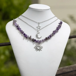 Detailed layered necklace featuring purple stone chips and celestial moon star charms