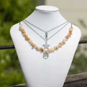 Detailed layered necklace set with silver moon pendants and natural crushed stones