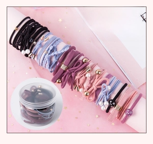 Detailed set of 25 elastic hair ties in a storage jar featuring various bead charms
