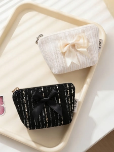 Mini tweed coin purses with elegant bow details in cream white and black gold textures