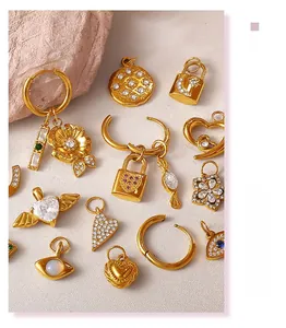 Detail showing variety of vintage gold-plated heart and lock pendants with colorful zircons