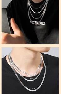 Three-layered silver snake chain necklace set in 40cm, 45cm, and 50cm lengths on a model