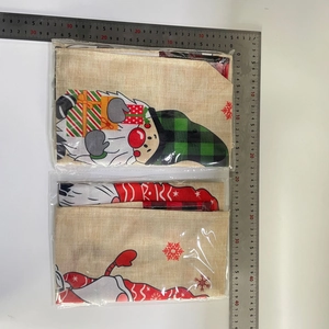 Flat lay of Christmas gnome linen placemats showing 45x30cm size with steel ruler