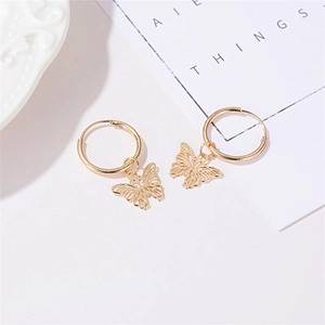 Elegant gold hollow butterfly pendant hoop earrings displayed on a minimalist white setting