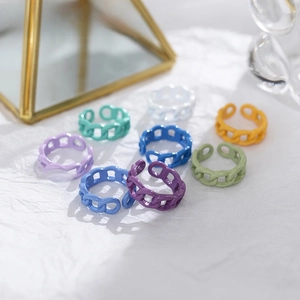 Close-up of colorful chain rings in pastel candy colors with an adjustable open design