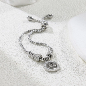 Detail of tree of life charm bracelet with white crystals and adjustable sliding clasp