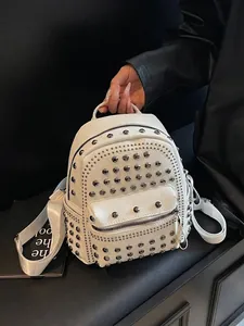 White faux leather backpack with silver studs and adjustable straps for women